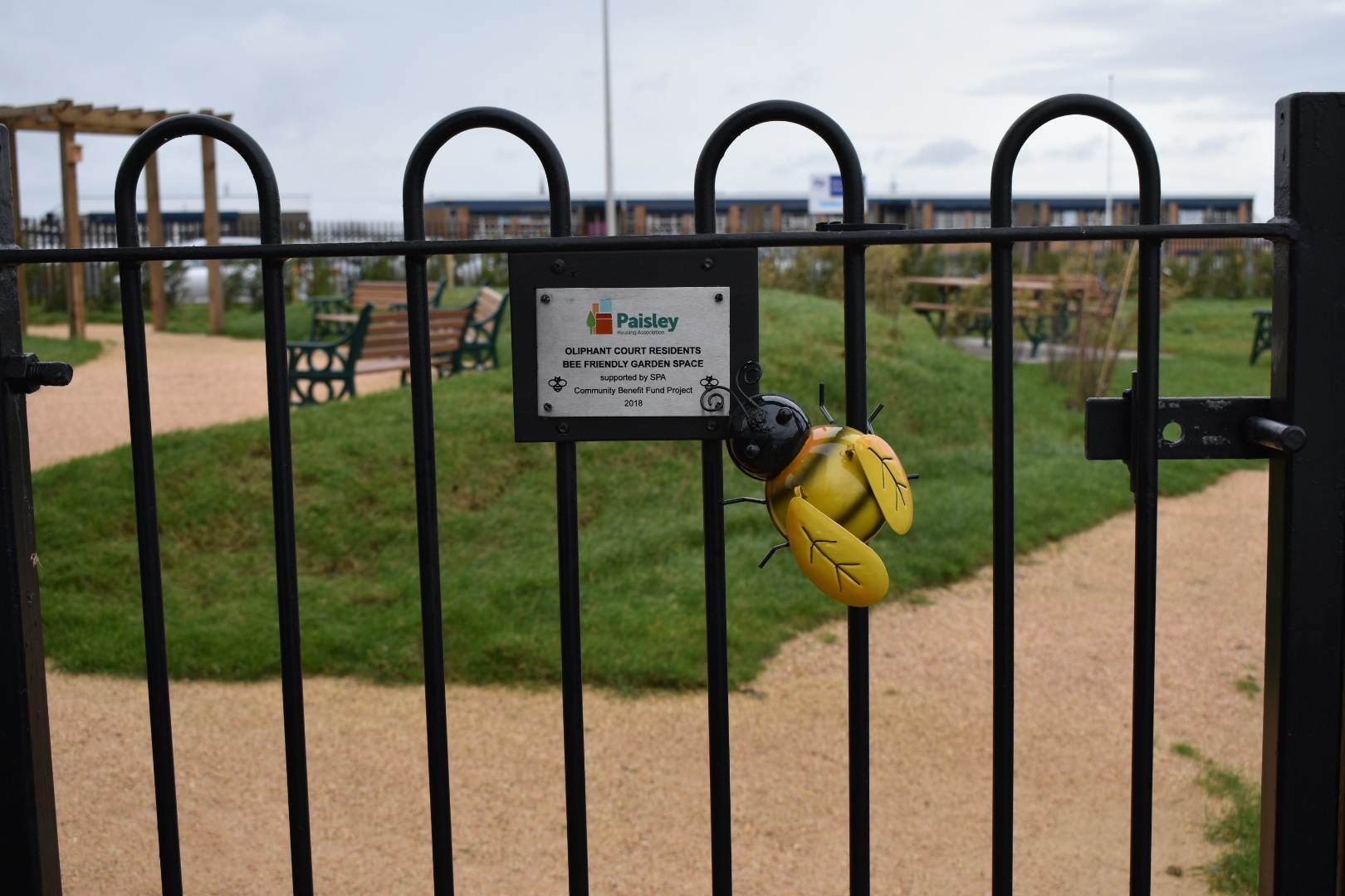 Garden gate with bee model