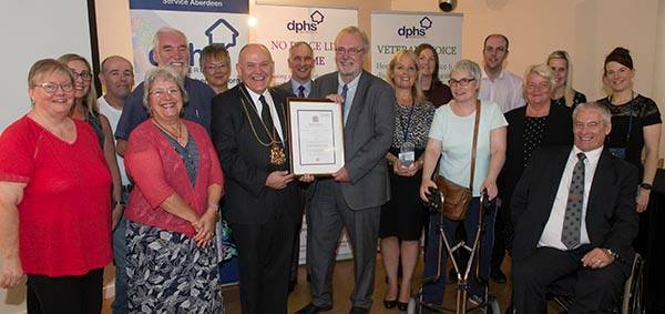 Group of DPHS people receiving the Queens Award